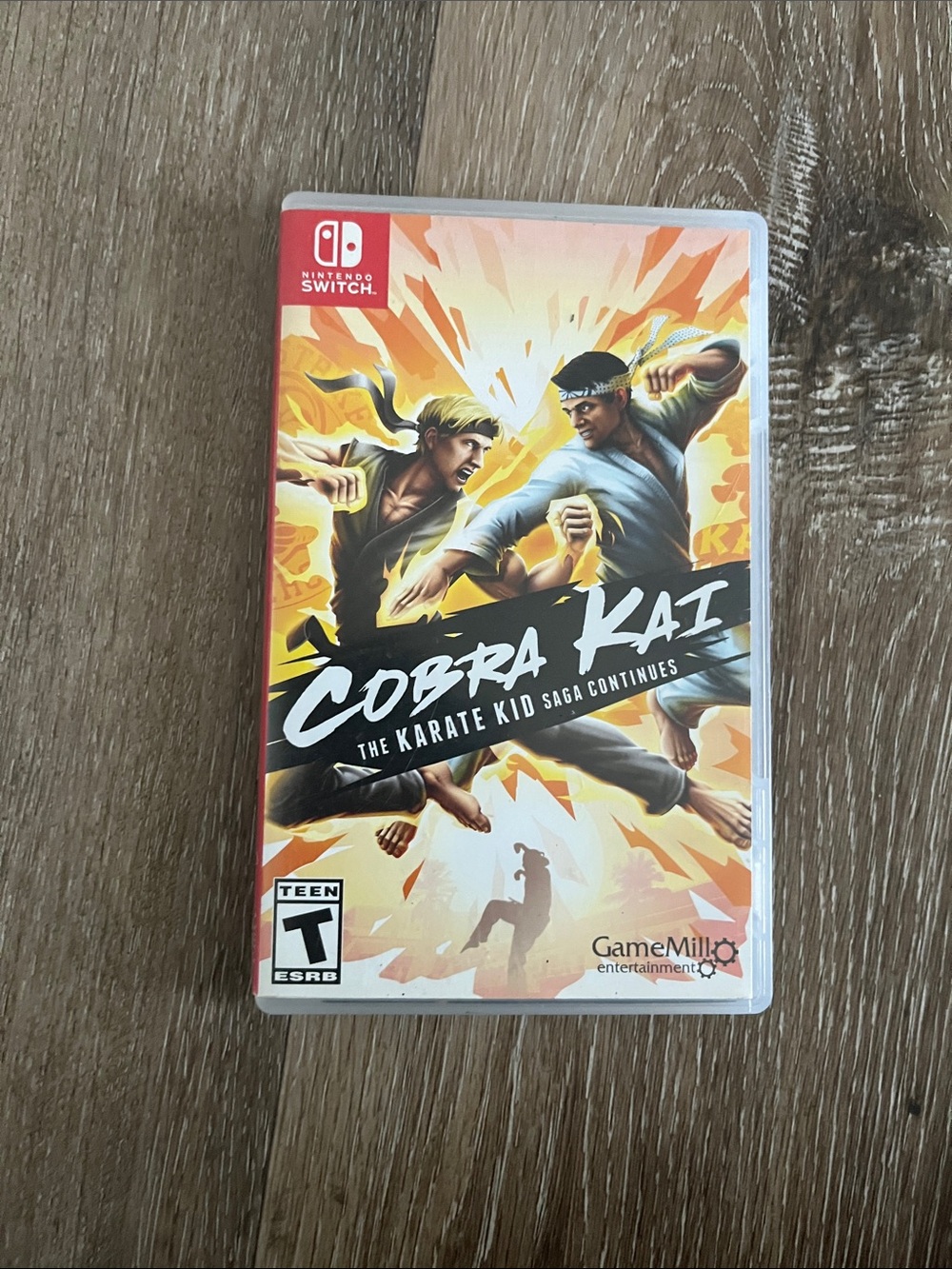 Nintendo Cobra Kai: The Karate Kid Saga Continues (Orange/Black/White)